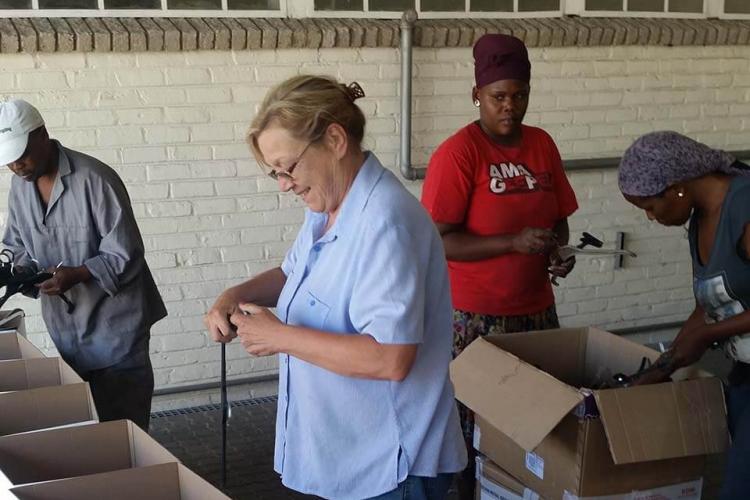 Job Creation Staff learning to sort hangers